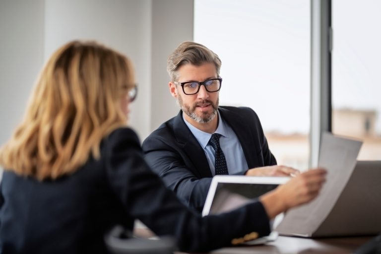 Shot,Of,Two,Businesspeople,Working,On,A,Laptop,In,The